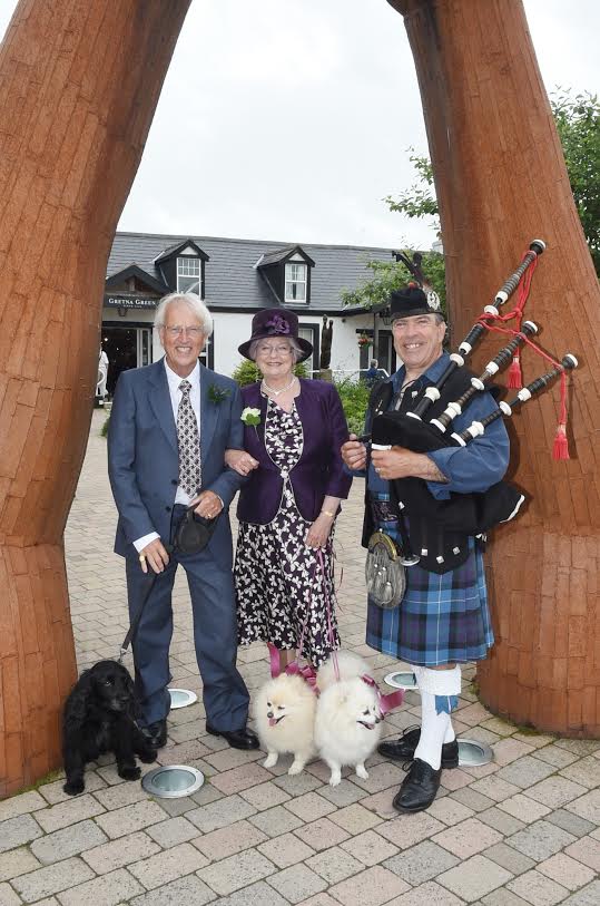 ONE IN A MILLION . . . Christopher Howard and Suzanne Storm were married last week at Gretna Green. Their dogs Molly, Peppermint and Pussycat were also in attendance