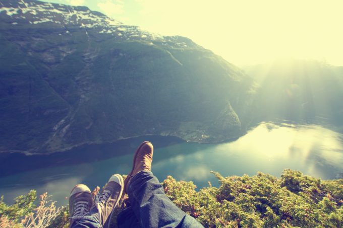 newlyweds honeymoon vacation in Norway. photo in the mountains near the lake. instagram.