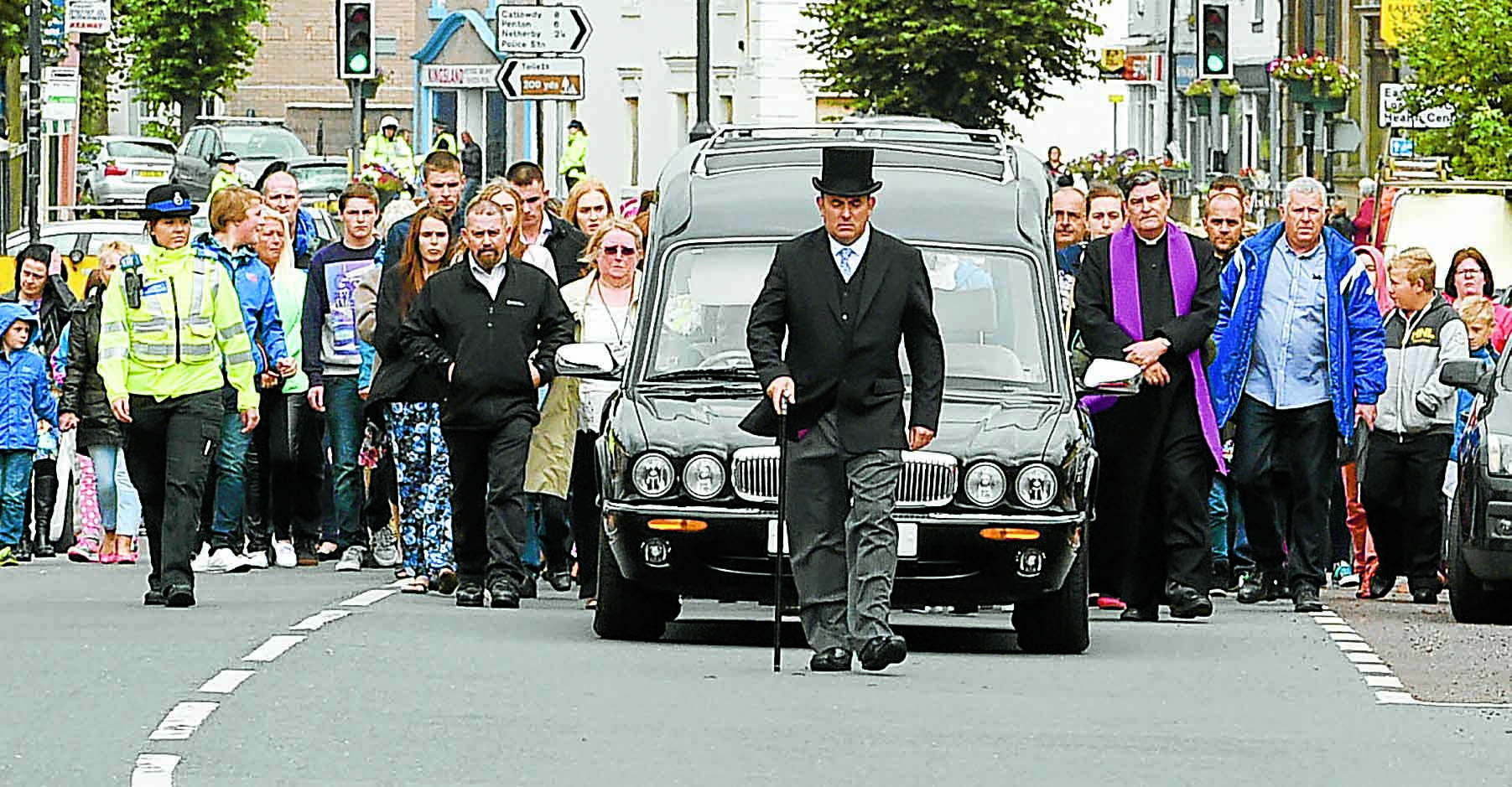 Mourners line streets for Mikey