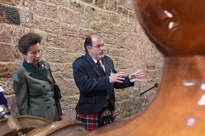 PROCESS . . . Princess Anne hears how the whisky is made