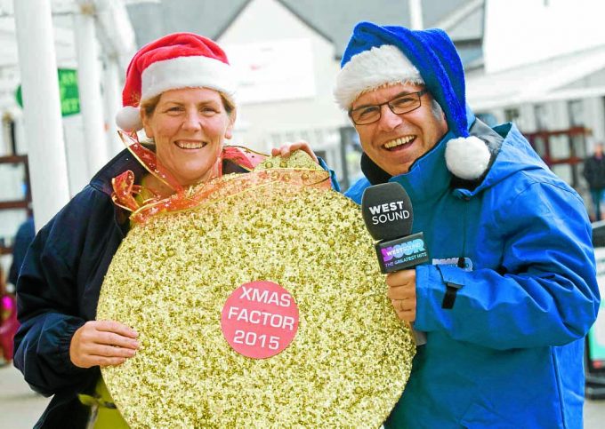 CAROL CONTEST . . . Lisa McNab, of Gretna Gateway, and Tommy Jardine, of West Sound, launch the 2015 Xmas Factor primary schools carol-singing competition