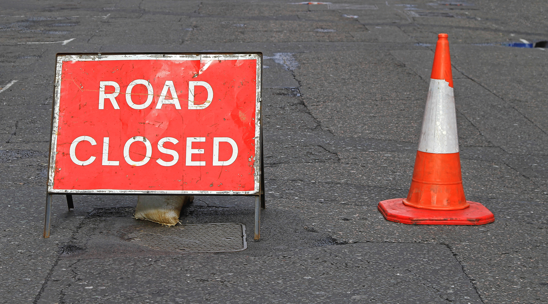 Fallen power lines close road