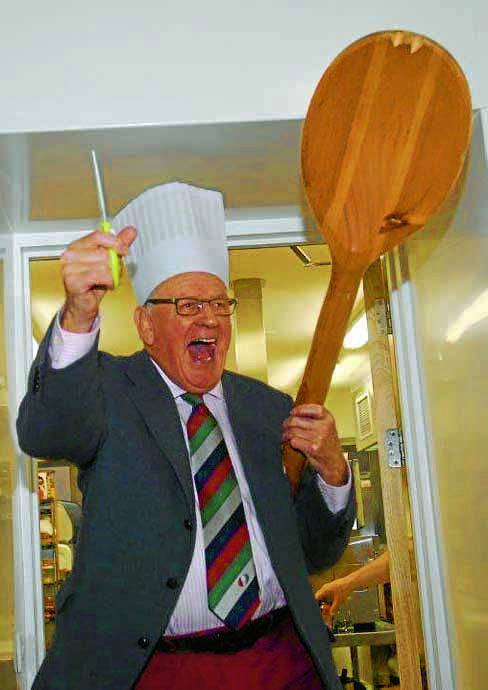 Peter C Brown cutting the ribbon for The Wooden Spoon Kitchen