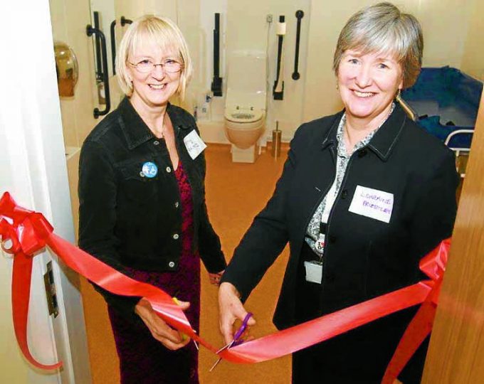 Jenny Miller and Lorraine Priestley Cutting the Ribbon of the Changing Places Facility.