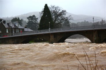 VIDEO/PICTURES: Raging river threatens flood defences
