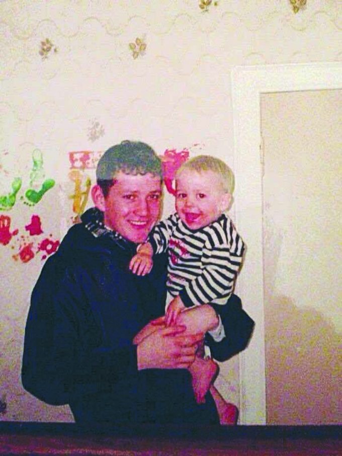 IN LOVING MEMORY . . . John Aitken, who died in 2014, aged just 32, holds younger cousin Daniel *** Local Caption *** IN LOVING MEMORY . . . John Aitken, who died in 2014, aged just 32, holds younger cousin Daniel