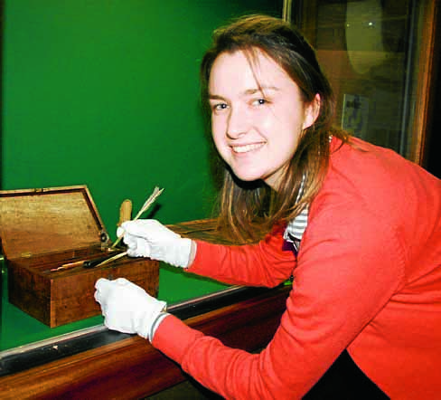 PRESERVATION . . . museum officer Lydia Cant displaying some of the early 19th century drawing tools that belong to local architect Walter Newall