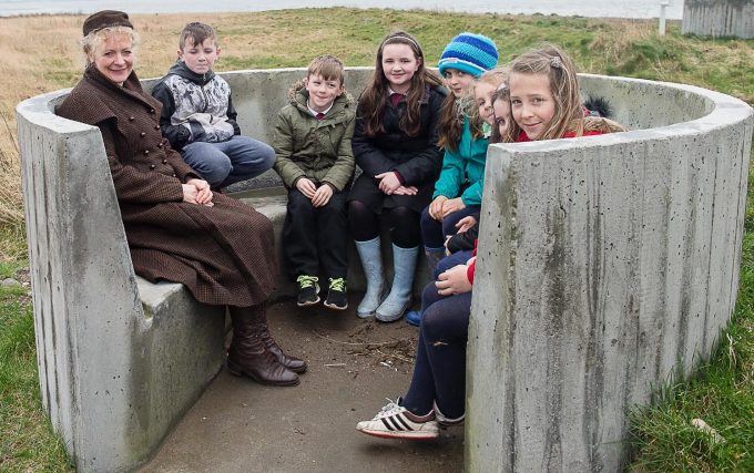 Dr Jan Hogarth and pupils try out the new seating area