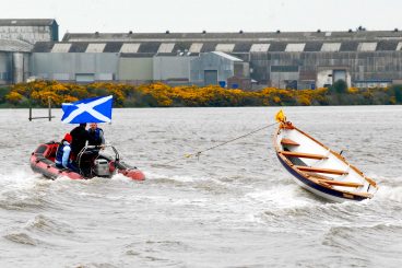 Race cut short after freak wave tips boat over