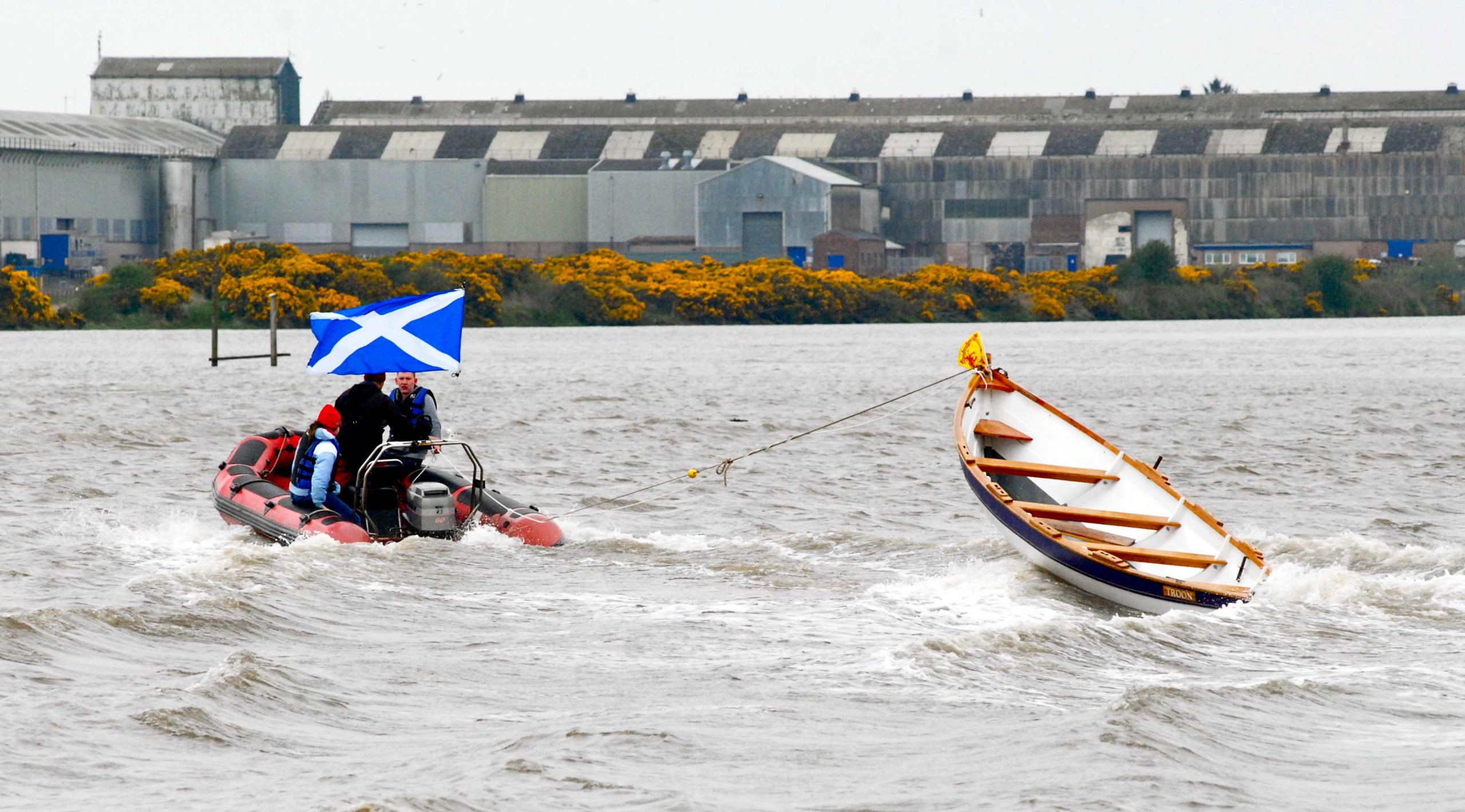 Race cut short after freak wave tips boat over