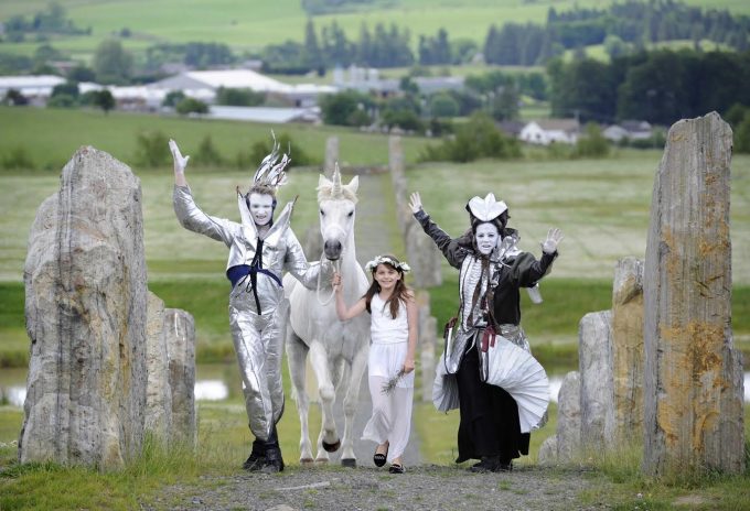    Lewis Sherlock, left, and Florence Garcia Chafuén from fantasy performance arts company Oceanallover in Moniaive prepare for this weekend's festival. Also pictured is with Murran Thin-Smith, from Lochmaben and Charlie the unicorn 