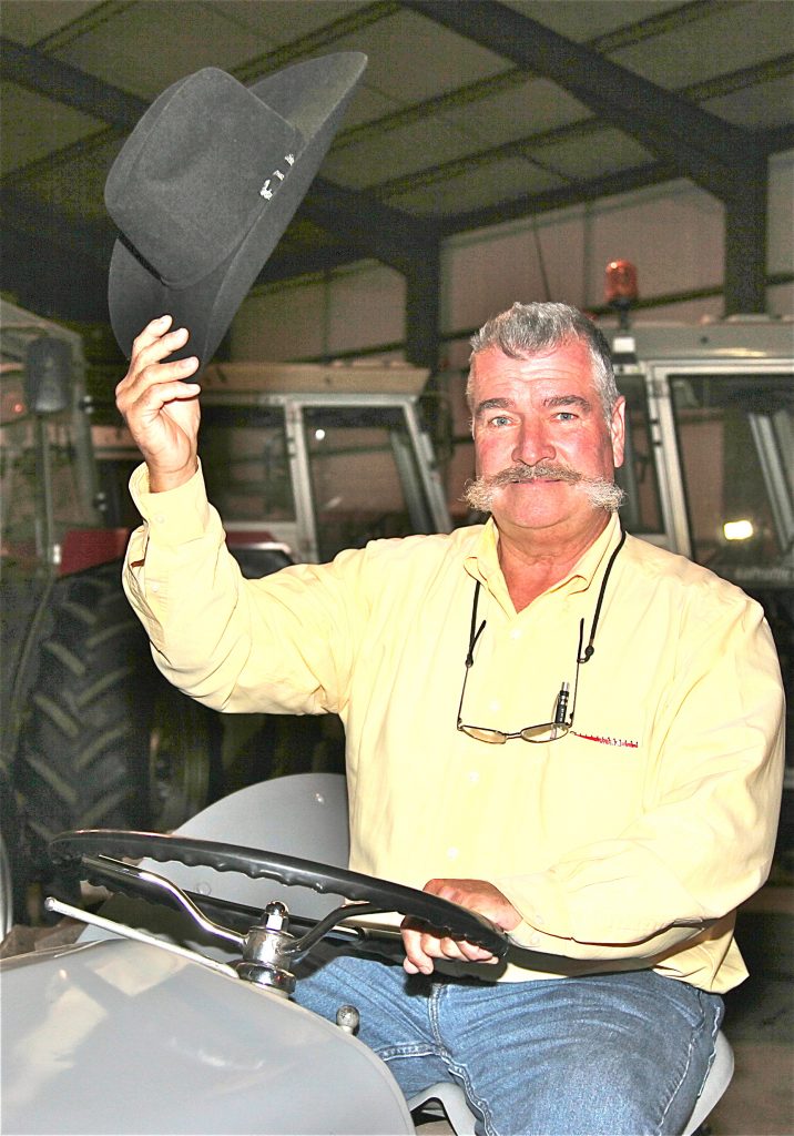 STATESIDE GREETINGS . . . Jeff McManus from Illinois lifts his hat to a much-loved grey ‘Fergie’ tractor