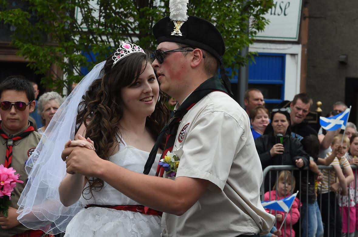 Scout leaders tie the knot . . .with a little help from their troop