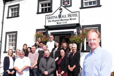 Family tourism firm buy historic hotel
