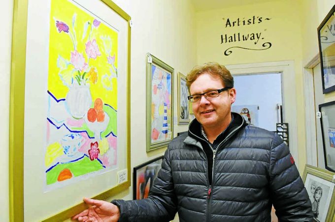 wq *** Local Caption ***  ON DISPLAY . . . Annan artist Jack O'Hara with one of his paintings which is on display in the new 'Artist's Hallway' in Home Sweet Home
