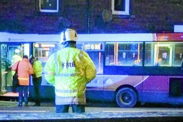 Two injured as bus crashes into front of house