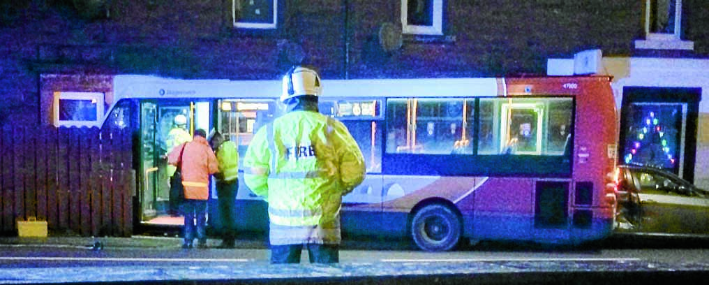 Two injured as bus crashes into front of house