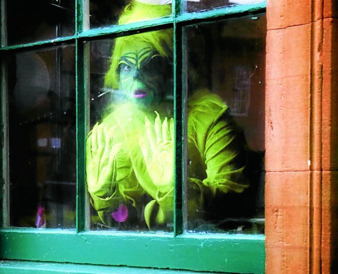 grinch *** Local Caption *** GREEN PERIL . . . Christmas is safe after The Grinch got himself locked inside Moat Brae house in Dumfries. The popular Dr Seuss creation was left behind after a weekend of festive fun. And there'll be no escape as the Georgian property has now closed ready for its transformation into the National Centre for Children's Literature and Storytelling. It won't reopen until 2018. See report, page 9
