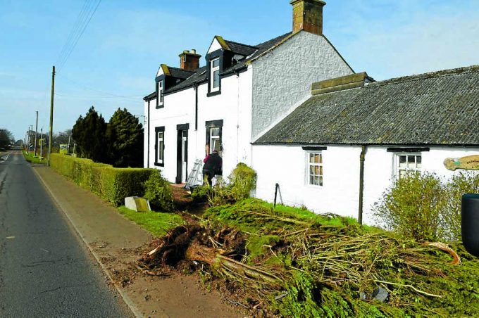 rigg damaged housed7d *** Local Caption *** CRASH SCENE . . . a truck smashed into the front of the Porter's house in Rigg