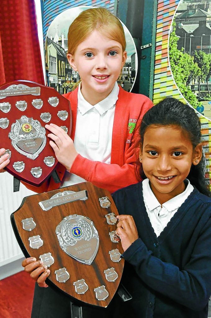civic pride rt *** Local Caption *** YOUNG WINNERS . . . left to right: acrostic poem winner Iona Dillon from Troqueer Primary and colouring winner Erina Hamilton from Brownhall Primary