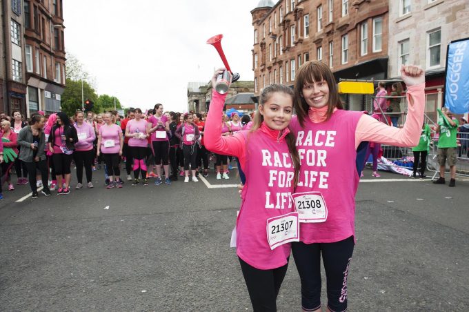 Eilidh and twin Louise Steel getting ready to start the race by sounding the air horn.Eilidh beat cancer after receiving specialist treatment in the US and got through it thanks to support from her sister louise.Cancer Research Uk's Race For Life Glasgow 2017.