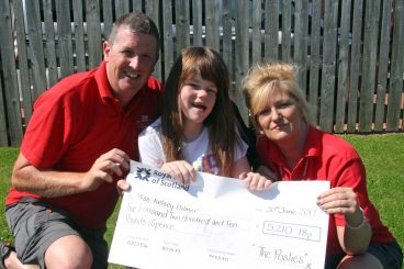 First class posties deliver wheelchair for Kelsey