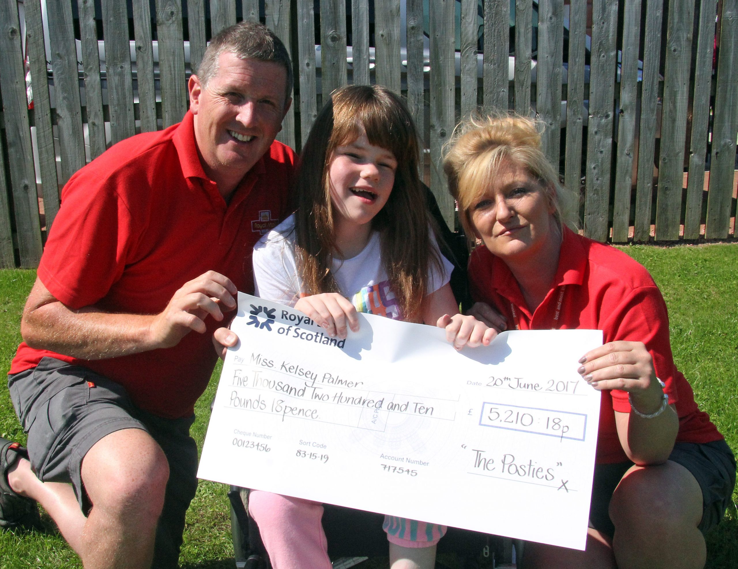 First class posties deliver wheelchair for Kelsey