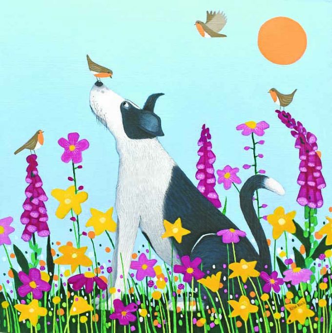 A collie dog with robins sitting in orange and yellow flowers