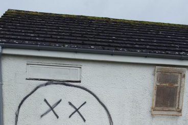 Villagers rally to clean-up graffiti before funeral