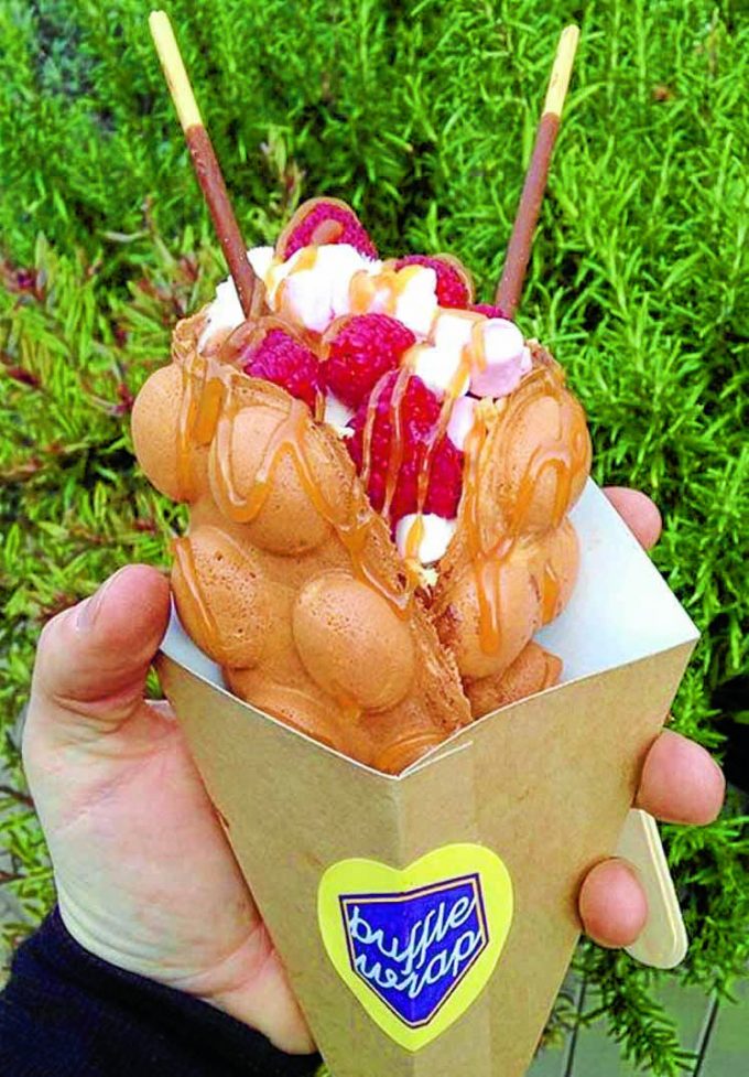 YUM . . . a bubble waffle by Buffle Wrap  *** Local Caption *** YUM . . . a bubble waffle by Buffle Wrap