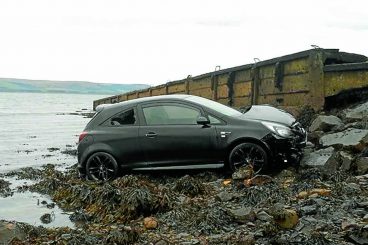 Woman rescued after car sea plunge