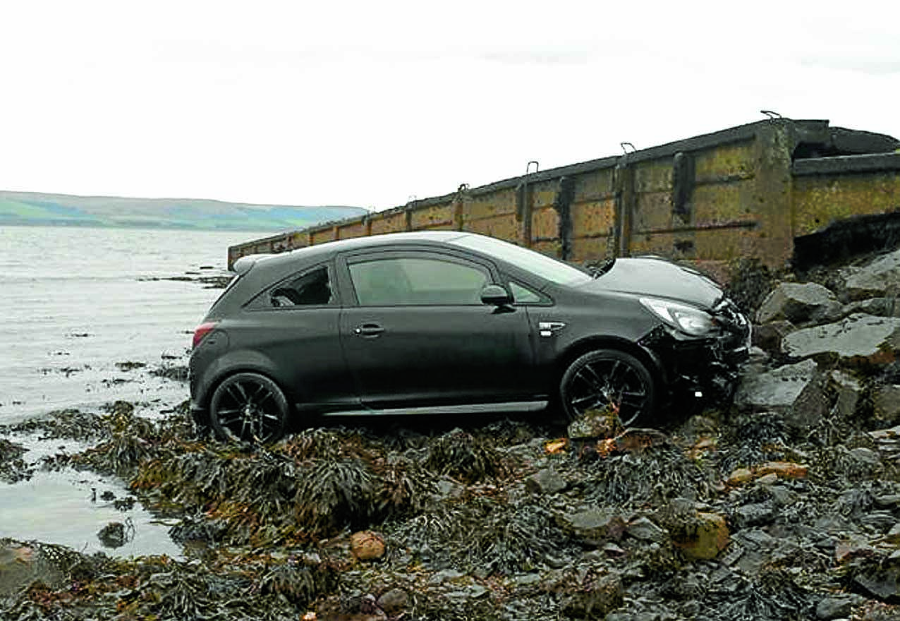 Woman rescued after car sea plunge