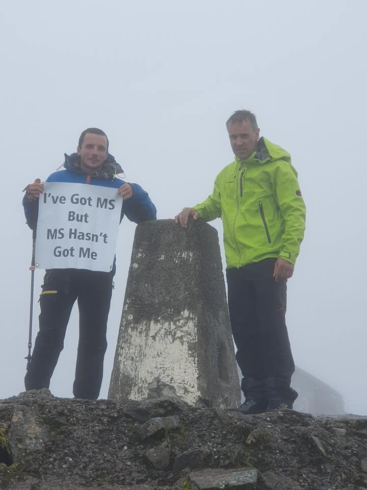 Adam is on top of the world after peak challenge