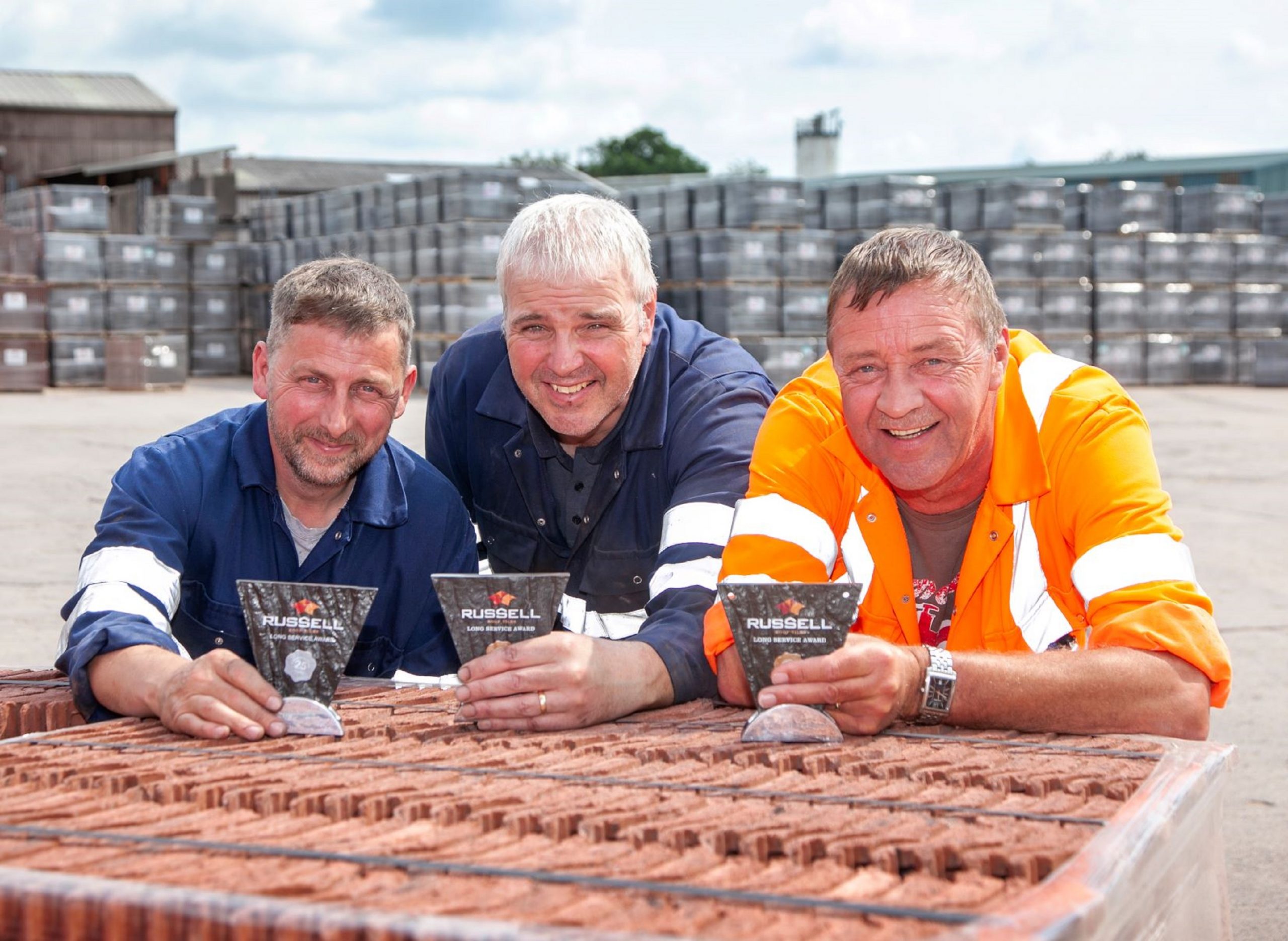 Trio put in 60 years of service at roof firm