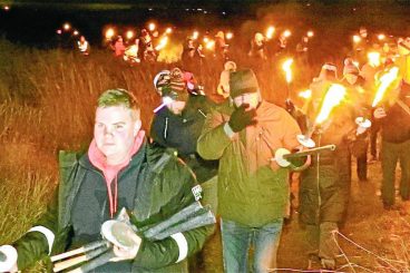 Blazing torches and moonlight take walkers back in time