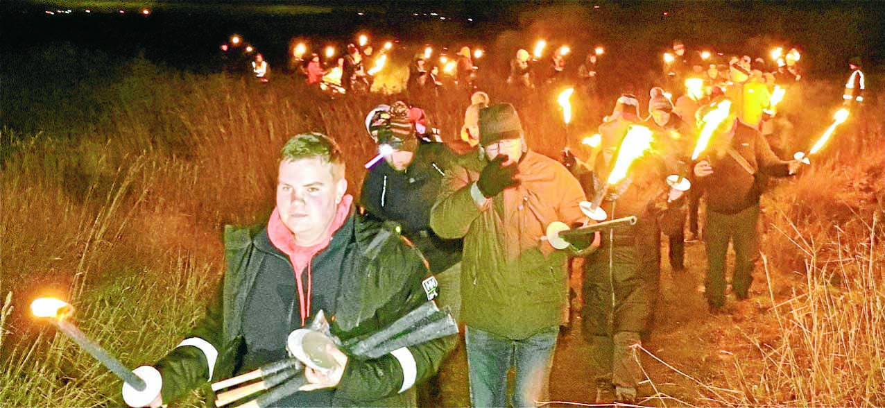 Blazing torches and moonlight take walkers back in time