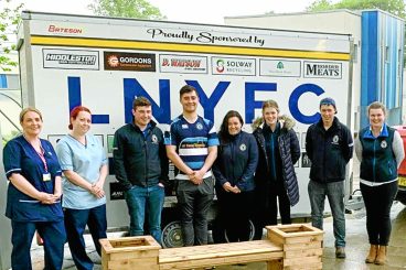 Young farmers help with hospital crop