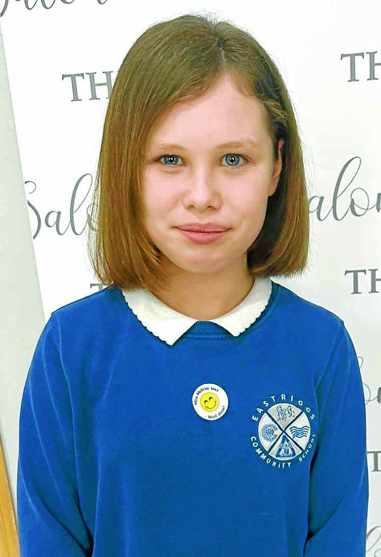 Schoolgirl cuts hair for charity