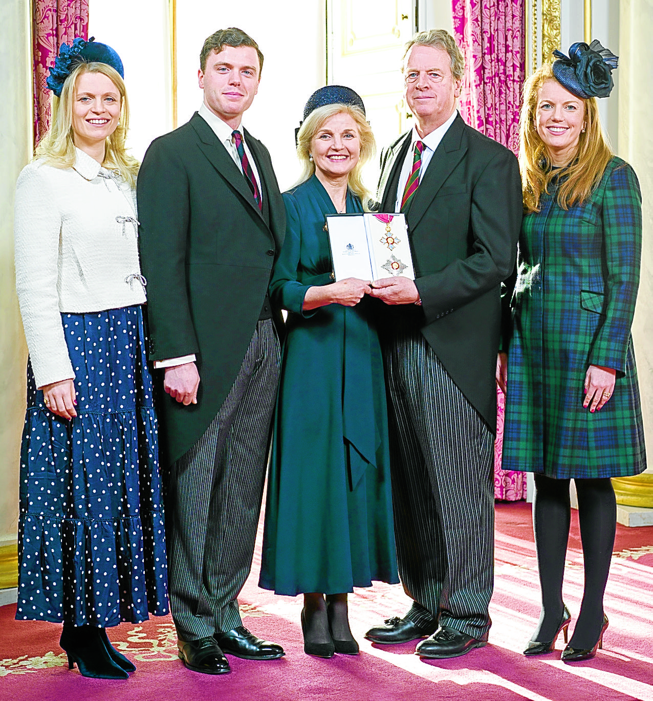 Former MP receives knighthood at the palace